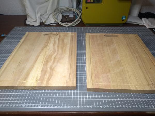 Two wooden cutting boards on a table.
